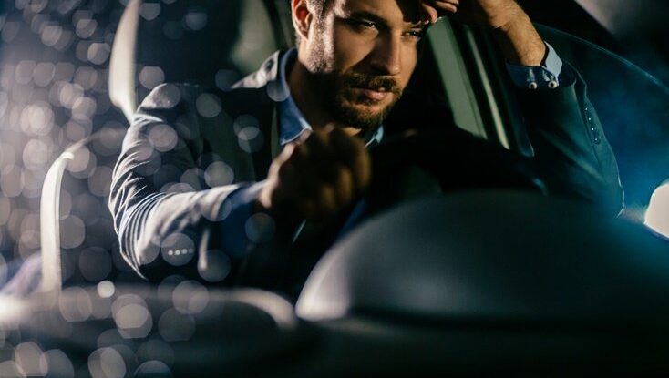 Businessman driving car