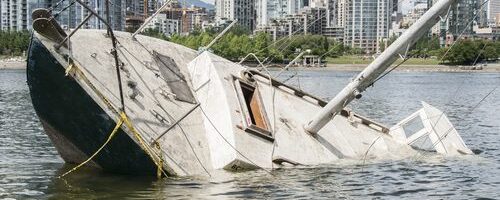 sailboat sinking in harbor after accident