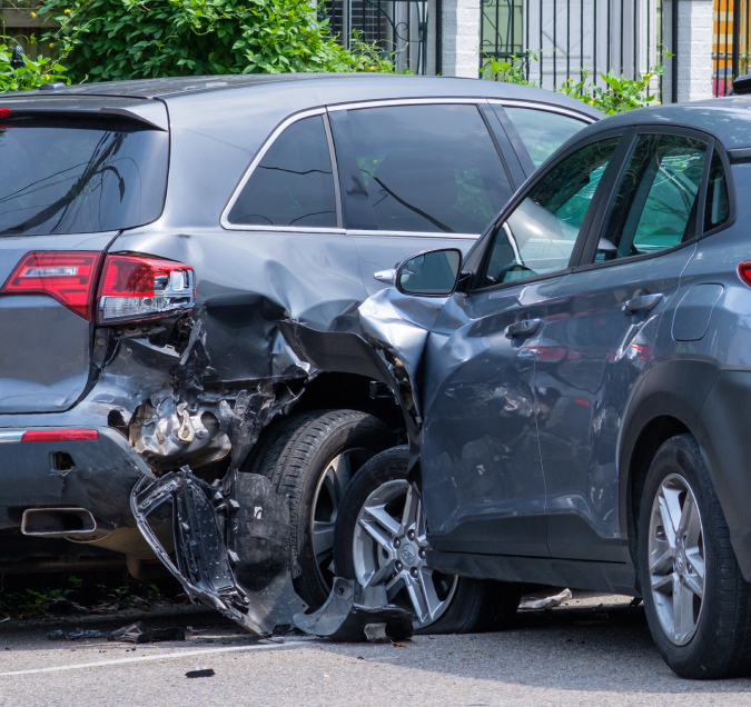 grey car t-boned another grey car at an intersection