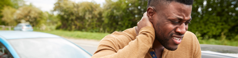 car accident personal injury victim holding neck in pain