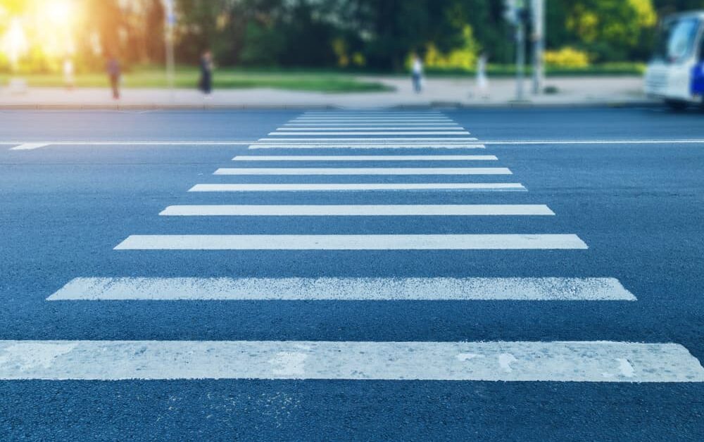 crosswalk with a car stopped