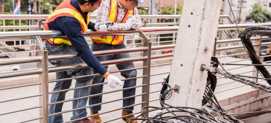 utility workers working outside in the elements