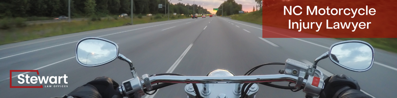 branded image with background of roadway from motorcyclists view with handlebars